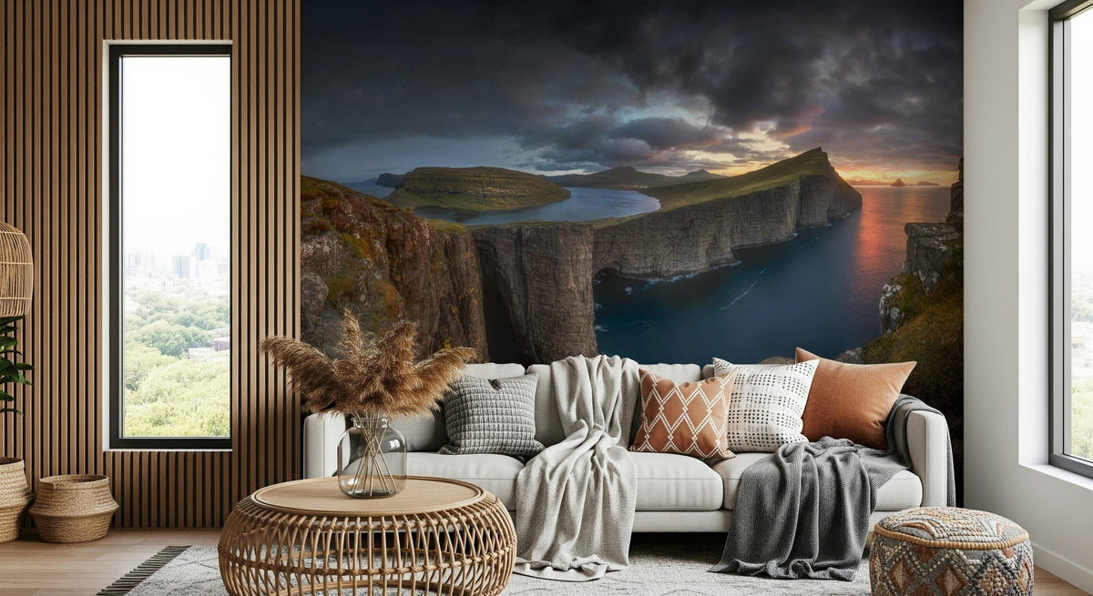 Faroe Cliffs Dawn wallpaper mural with sunset sea cliffs above a white sofa in a wood-panelled living room
