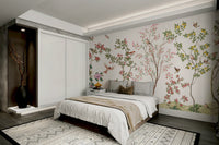 A peaceful wall mural with a design of flowers and flying birds or butterflies.

