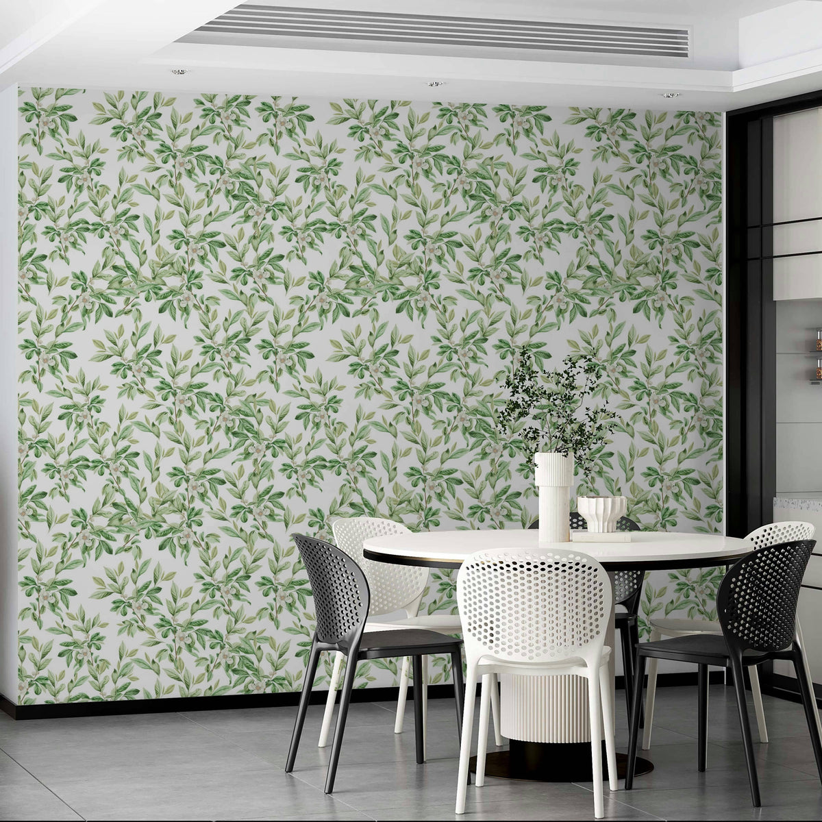 A bedroom decorated with a leaves mural

