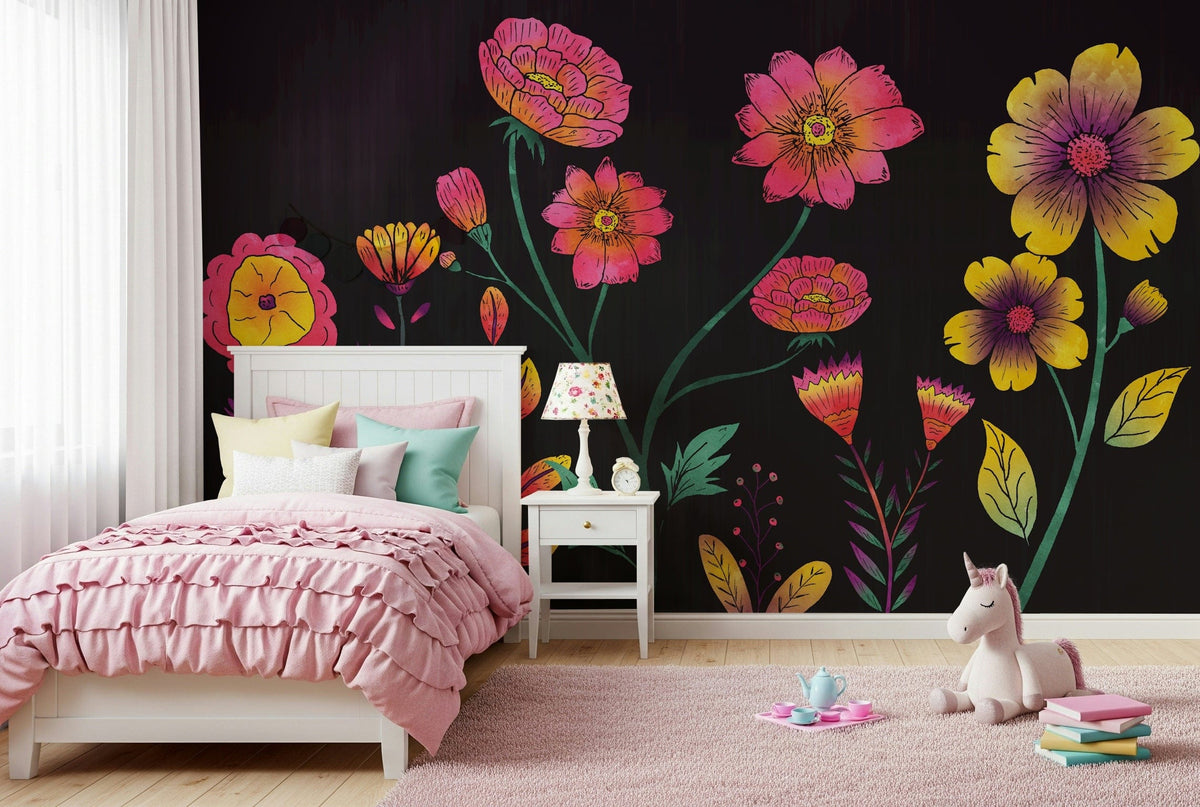 Luminous Floral Whispers wallpaper mural of glowing pink and yellow flowers on black behind a white bed with pink ruffled bedding in a girls room