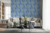 Blue bouquet tile wallpaper behind open shelves in modern kitchen, glossy tile feel