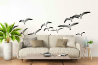 Serene Flying Birds wall mural with birds soaring across the sky.

