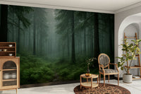 Foggy wilderness mural with towering trees and lush greenery.

