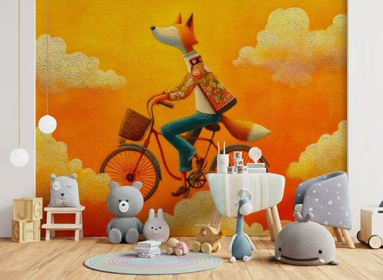 Fox's Aerial Adventure mural of a fox cycling in orange clouds in a nursery with plush bear and whale toys