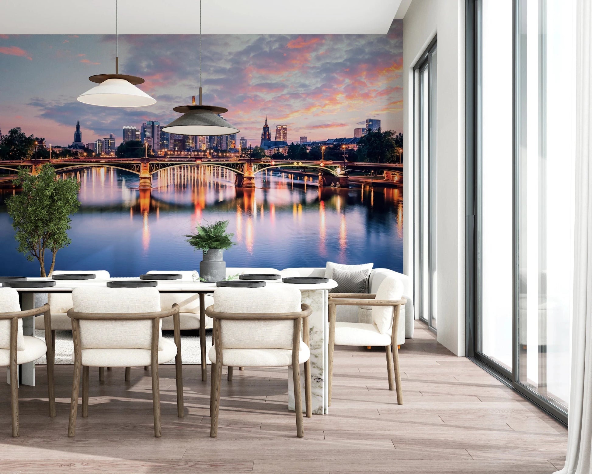 Frankfurt Dawn wallpaper mural of the lit bridge and skyline in a dining room with white chairs and pendants
