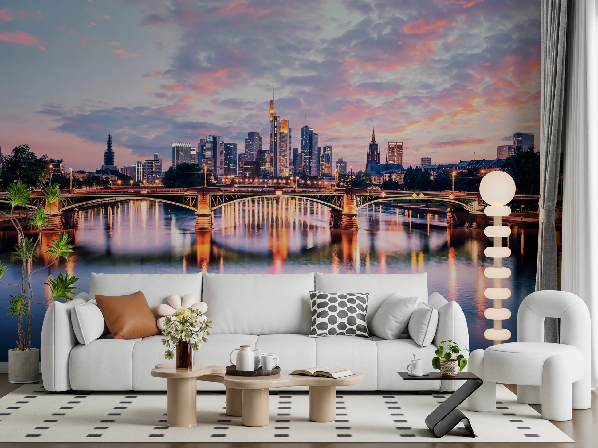 Frankfurt Dawn wallpaper mural of the skyline and bridge reflections behind a white sofa on a polka-dot rug
