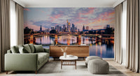 Frankfurt Dawn wallpaper mural of the sunset skyline and bridge behind a green sofa and walnut sideboard