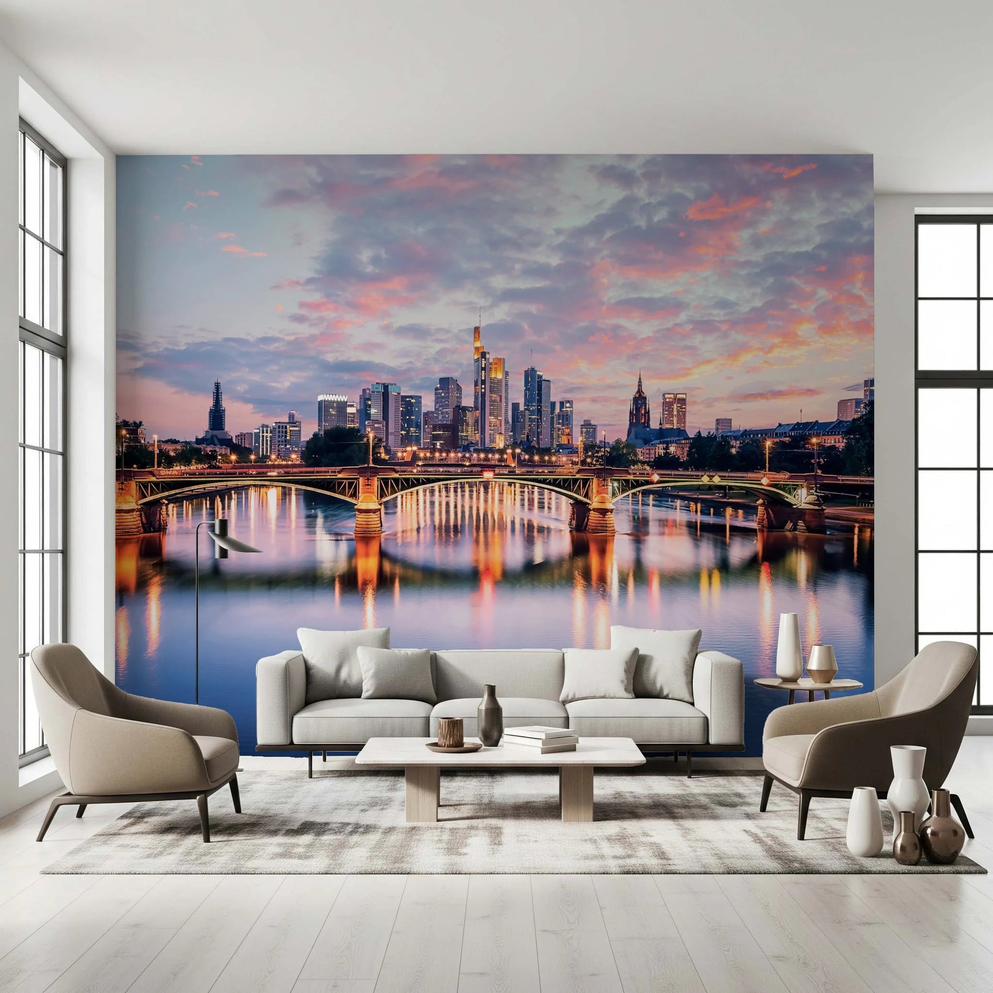 Frankfurt Dawn wallpaper mural of the lit Main bridge and skyline behind a beige sofa between two armchairs