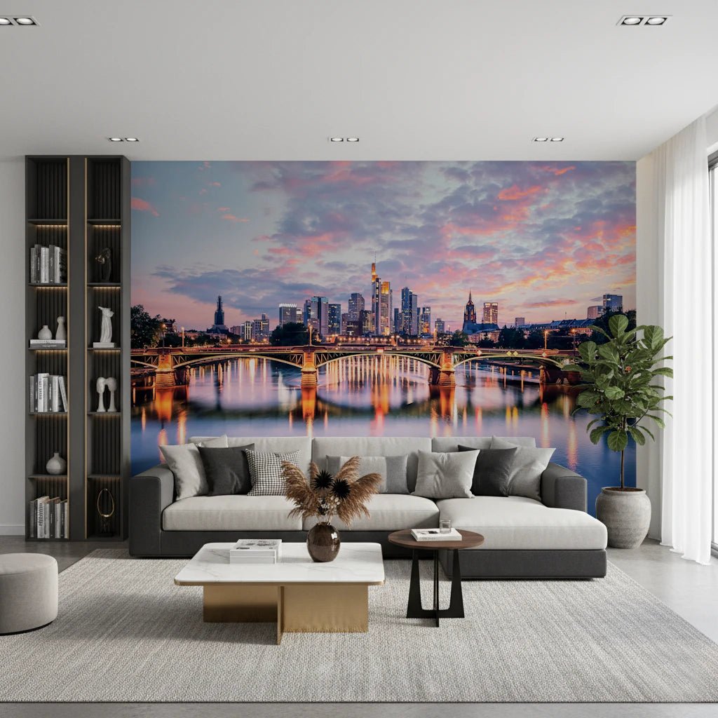 Frankfurt Dawn wallpaper mural of the glowing skyline and river behind a grey sectional and gold marble table