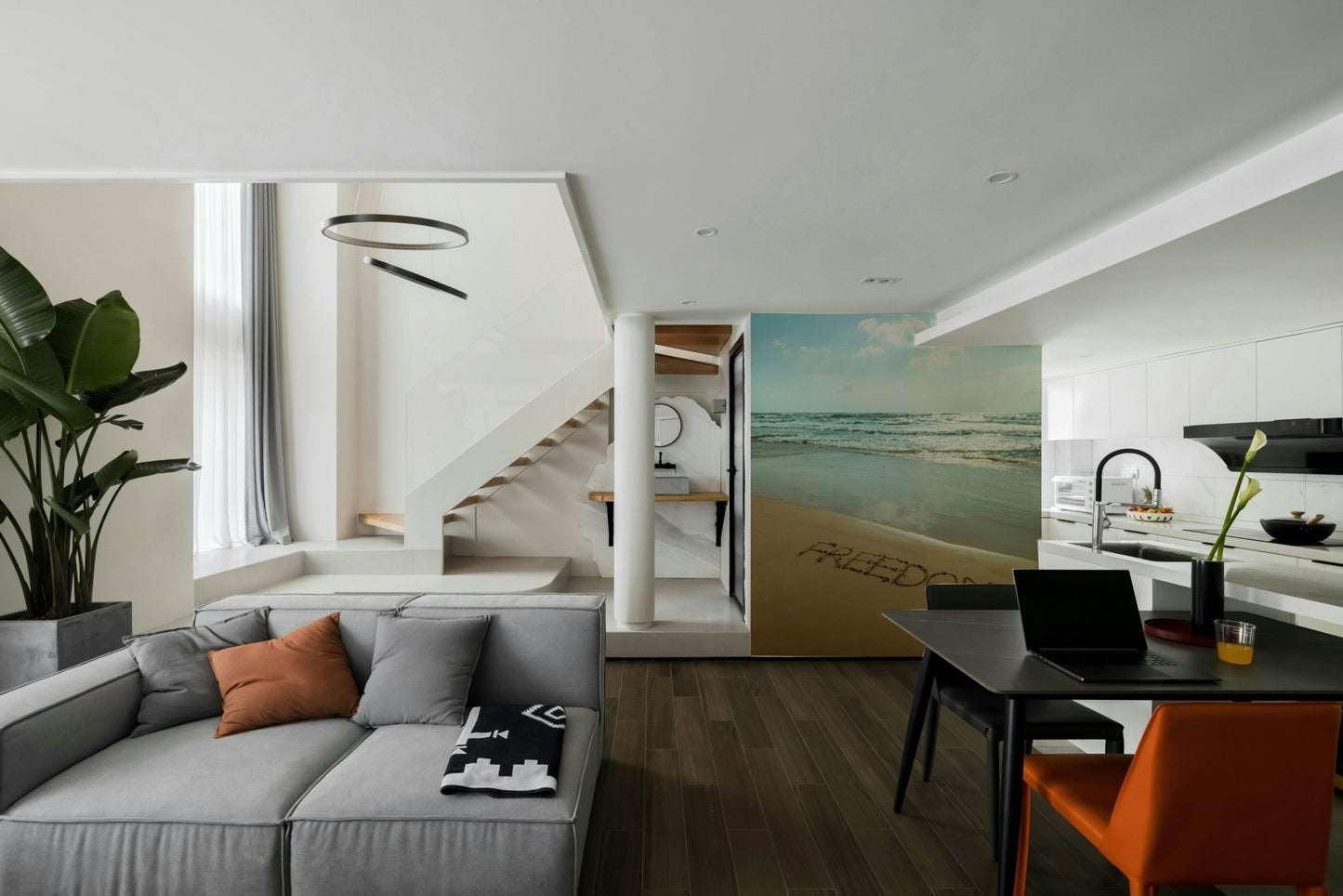 A wall mural featuring a peaceful beach scene.

