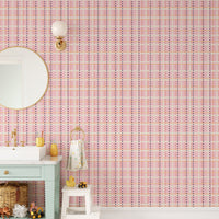 Removable self adhesive French Dotted Checks Pink Wallpaper in a vanity area with a round mirror.
