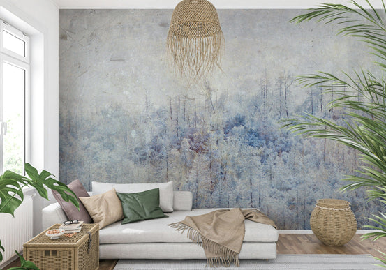 Frosted Forest Dream wallpaper mural of pale blue winter woodland behind a white daybed with green pillows