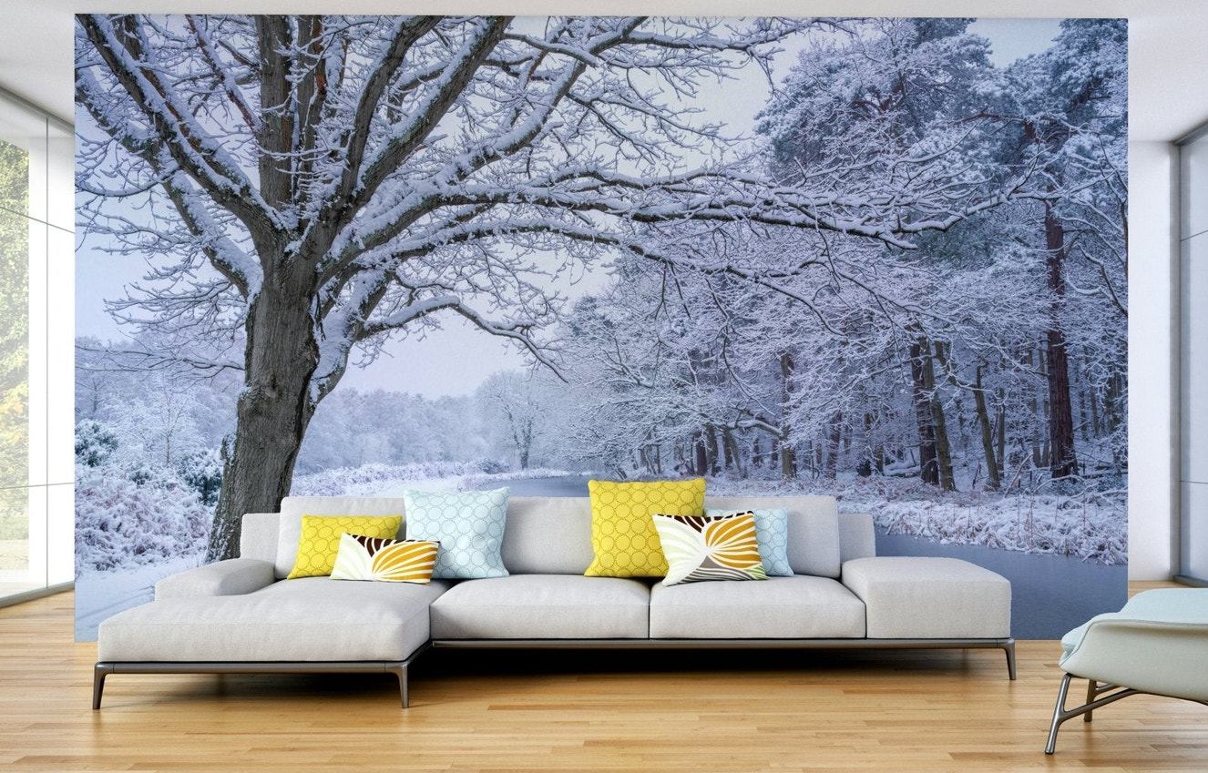 Snow-covered trees beside frozen stream mural

