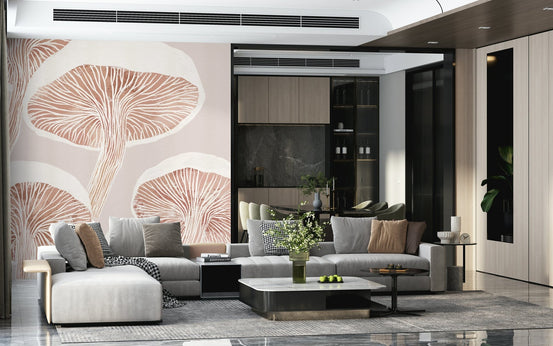 Fungi Forest Charm wallpaper mural with blush mushroom caps behind a large gray sectional sofa in a living room