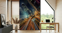 Metropolis Skyline Velocity wall mural glowing windows intense upward angle.