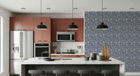 Leafy botanical wallpaper creating a soft, calming atmosphere with neutral colors.