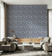 Minimalist foliage wallpaper with softly textured leaves on a muted backdrop.