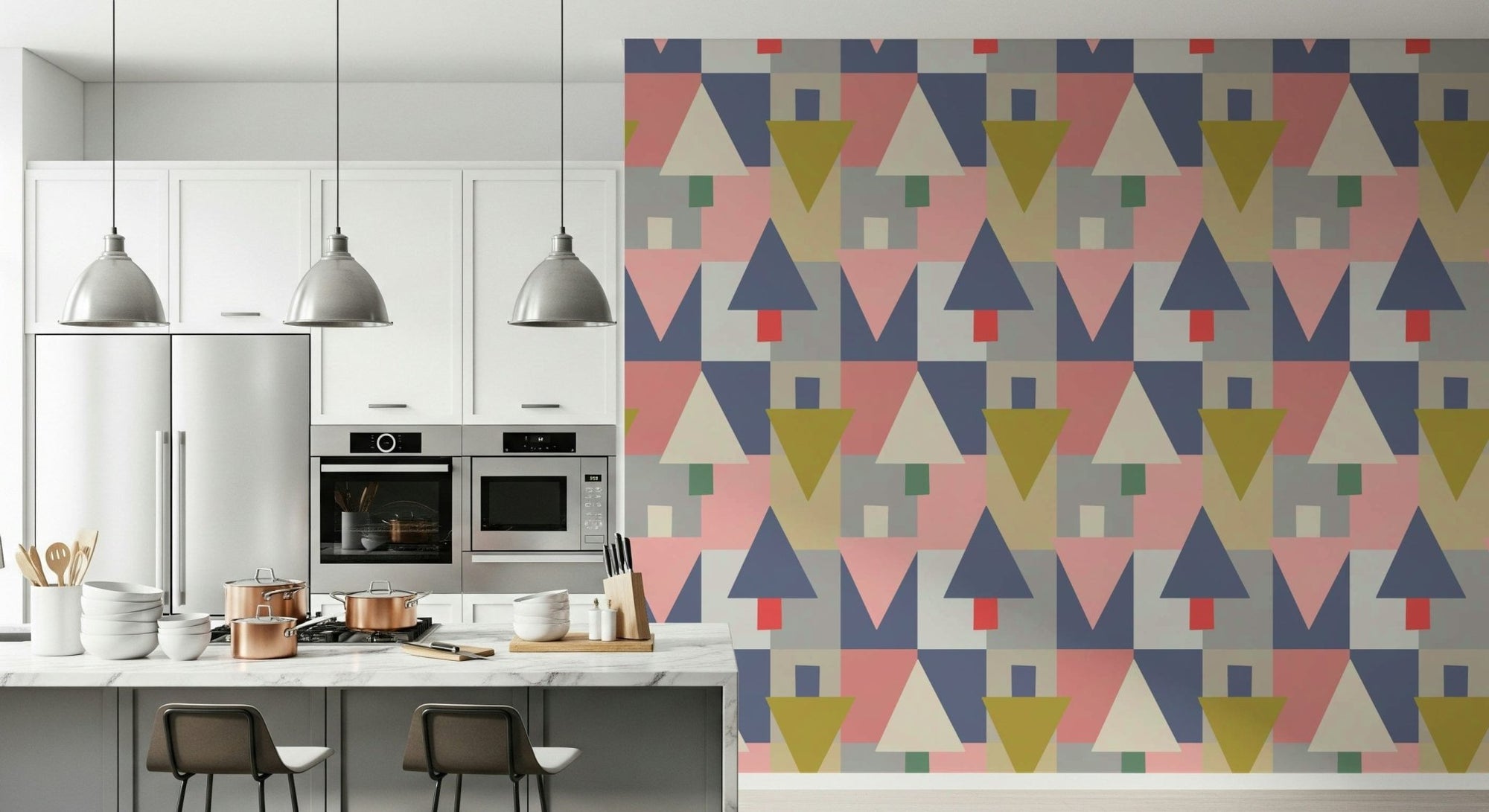Geometric Forest Harmony wallpaper of pastel triangle trees beside a white kitchen island with copper pots