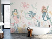 Dreamy Aquatic Ballet wallpaper of watercolor mermaids and seaweed behind a white freestanding tub in a bathroom