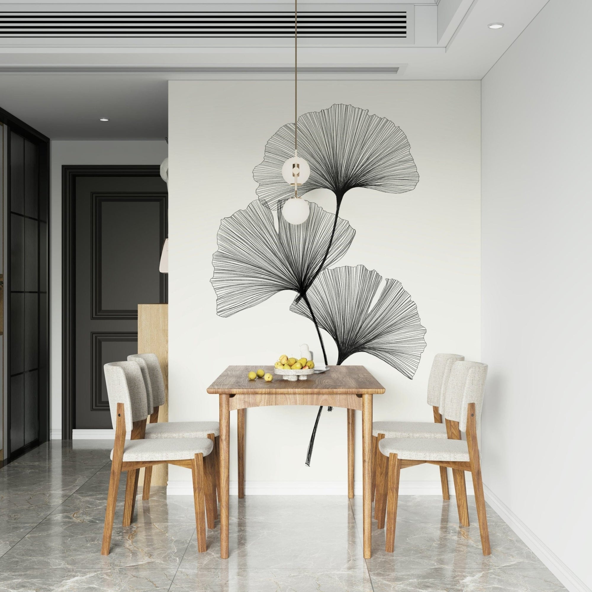 Ginkgo Line mural of black line-art leaves on cream behind a wooden dining table and beige chairs