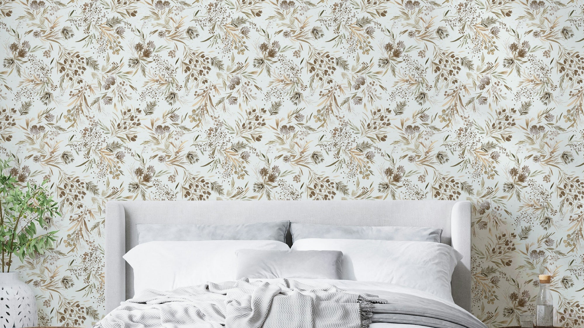 Festive Floral Minimal Plants Gold wallpaper behind an upholstered grey headboard and white bedding in a bedroom