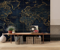 Golden atlas mural with world map grid and ocean labels