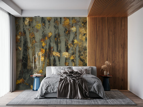 Gilded Autumn Woods wallpaper mural of gold leaves on grey trees above a grey bed by a wood-slat wall