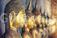Zen inspired wall decor behind a dark wood office desk.