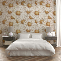 Delicate golden daisy design on soft-toned mural wallpaper.

