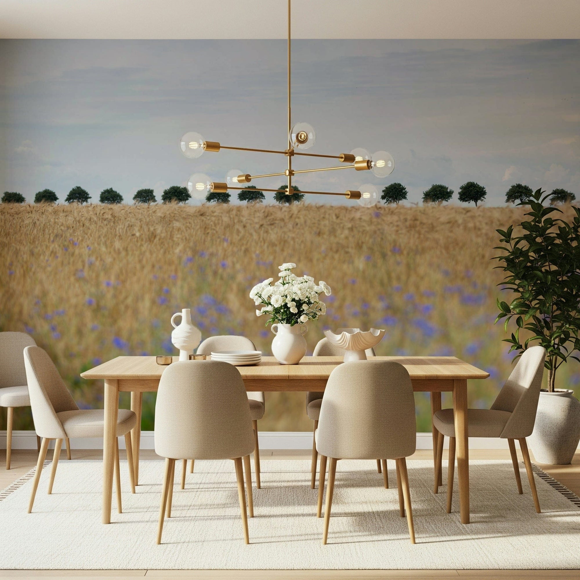 Golden Fields Serenity wallpaper mural of a wheat field with cornflowers in a dining room with beige upholstered chairs