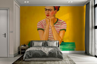 Abstract portrait mural bathed in warm golden light

