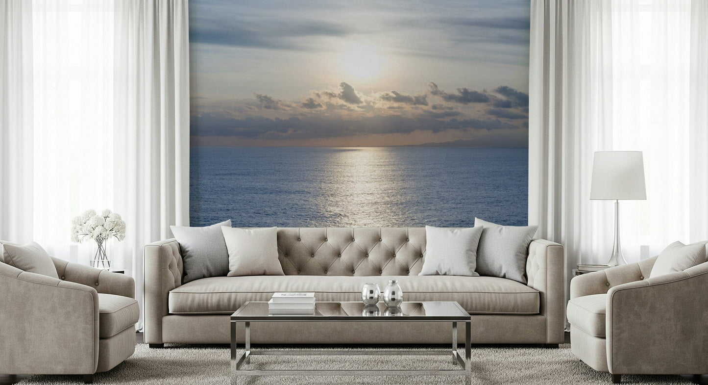 Ocean’s Golden Embrace Wall Mural behind sofa in apartment, soft gold and blue