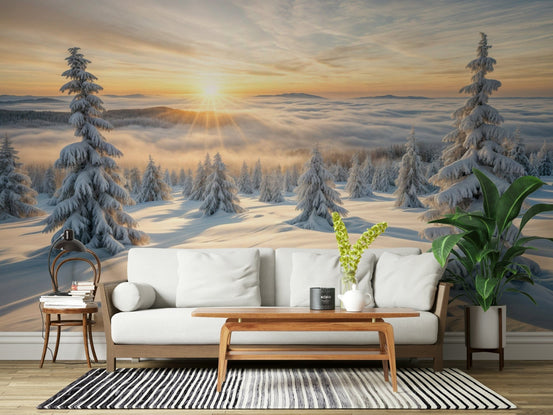 Golden Winter Woods wallpaper mural of a snowy forest at sunburst behind a white sofa and wood table in a living room
