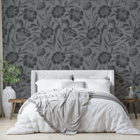 The image features large flower and leaf shapes shown as soft silhouettes.
