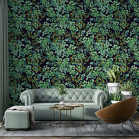 A bedroom decorated with a foliage mural

