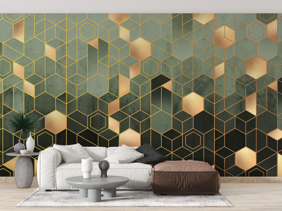 Green Geometric hexagonal wallpaper mural in sage and gold behind a white sofa and brown leather pouf in a living room