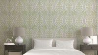 Elegant green leaf damask wallpaper pattern on wall


