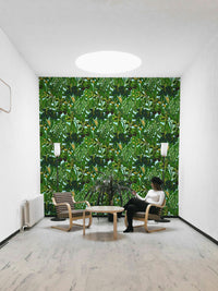 An angled shot of a wall with green wallpaper


