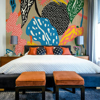 Tropical jungle-inspired wall mural with playful details

