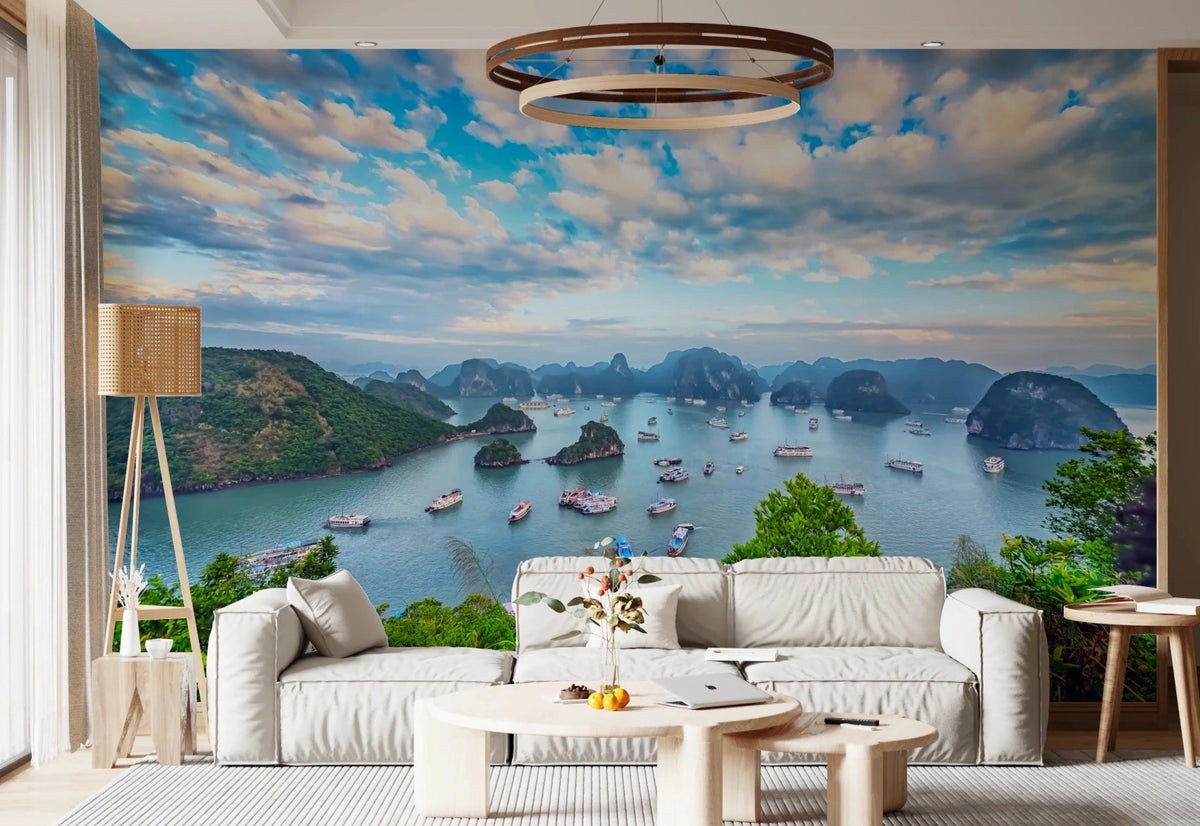 Halong Bay Vista wall mural of karst islands and boats behind a white sofa and ring chandelier in a living room