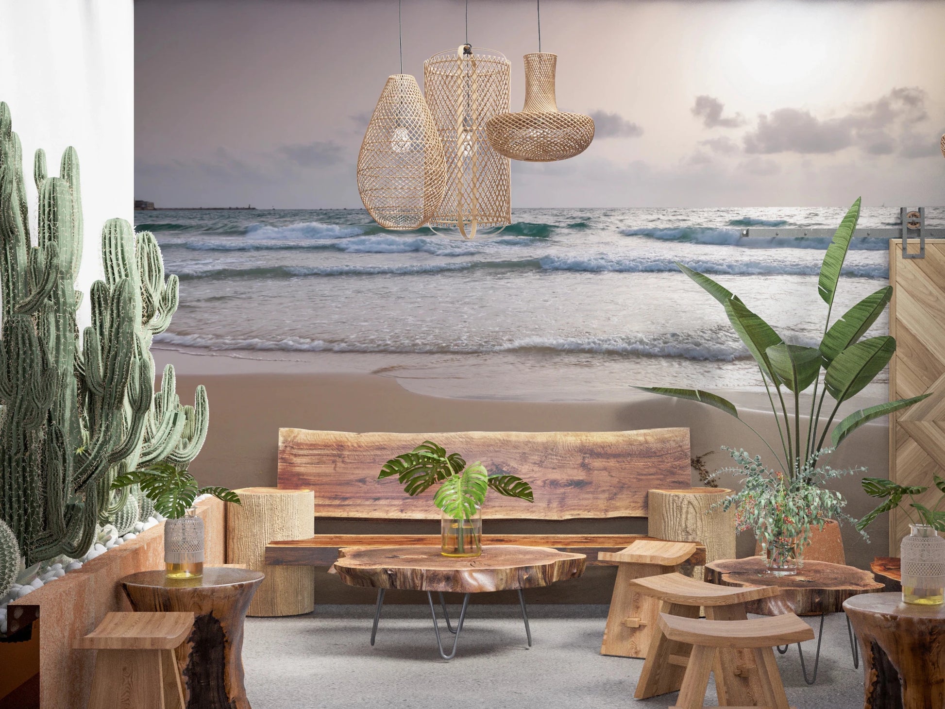 Happy Beach Vibes wallpaper mural of dusk waves behind a live-edge wood bench and tall cacti in a boho lounge