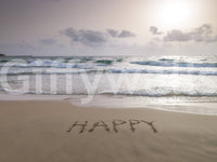 Happy Beach Vibes wallpaper mural shown full-wall, a dusk beach with HAPPY written in the sand and rolling waves