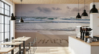 Happy Beach Vibes wallpaper mural of a sandy beach behind wood tables and an espresso bar in a cafe