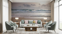 Happy Beach Vibes wallpaper mural of a calm beach behind a grey sofa flanked by sage armchairs in a living room