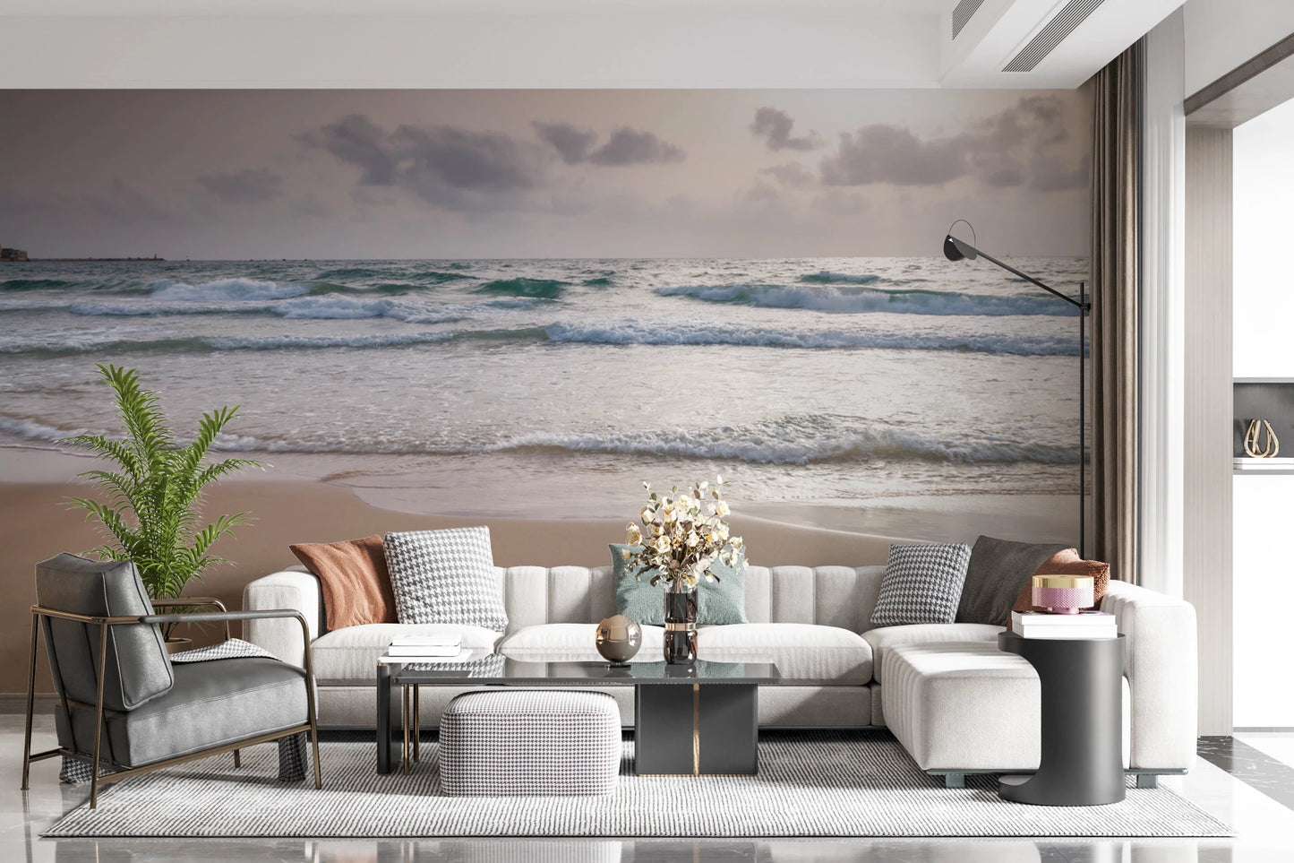 Happy Beach Vibes wallpaper mural of turquoise surf behind a white sectional and grey chair in a living room