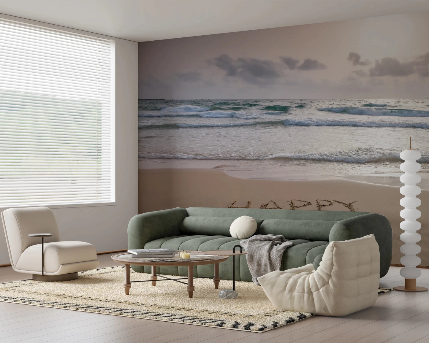 Happy Beach Vibes wallpaper mural of beach surf behind a sage green sofa and cream beanbag in a living room