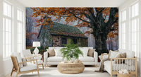 Autumn cottage wall mural with orange canopy, textured stone, and quiet woodland