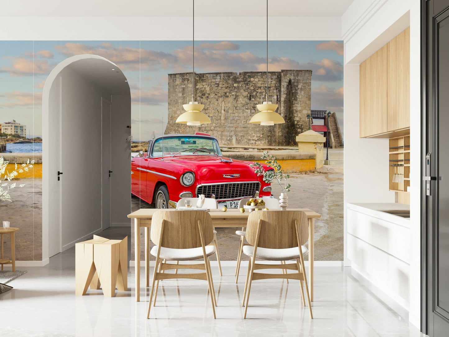 Lounge mural showing classic car in Havana, modern sofa, teal and coral accents