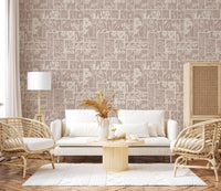 Delicate floral wallpaper with a muted pink background, ideal for a cozy living room.