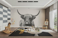 Distinctive long horns and gentle eyes.

